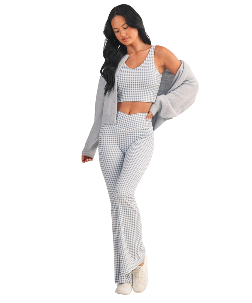 Woman wearing a light blue and white GINGHAM checkered tank on a white background