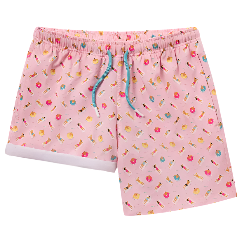 A pair of men's swim shorts with a pink base and a pattern that includes various beach and summer-themed graphics in multiple colors.