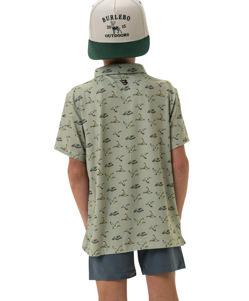 Child wearing a flying duck patterned shirt and cap with 'Burlebo' branding on a white background