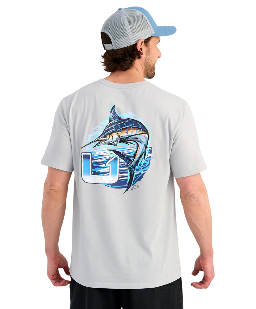 Man wearing a light gray t-shirt with a MARLIN fish graphic and logo on the back, standing against a white background.