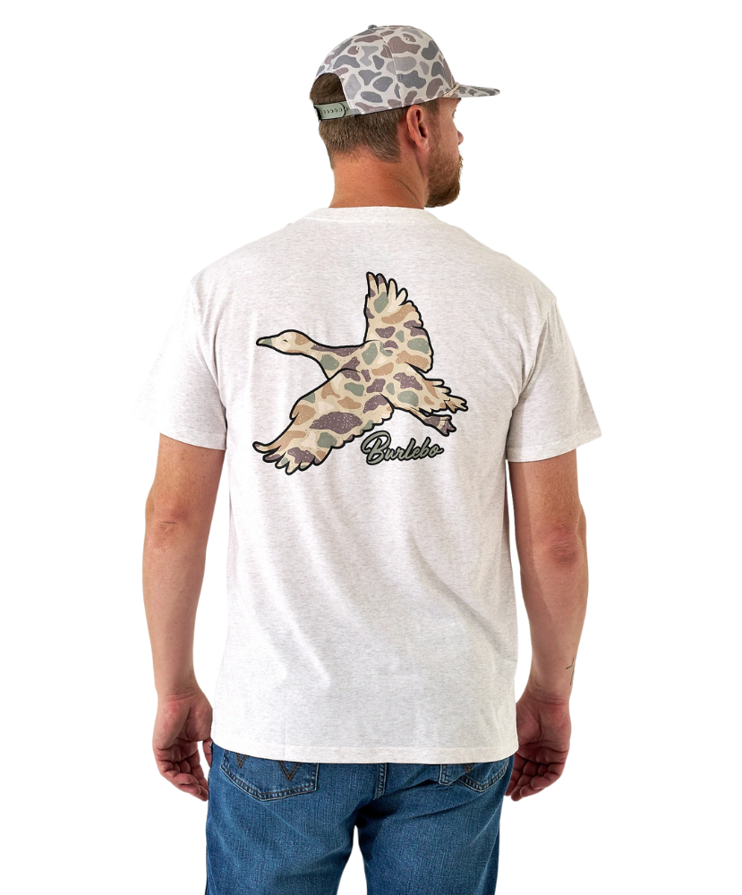 Man wearing a white t-shirt with a camouflage duck design on the back, standing against a white background.