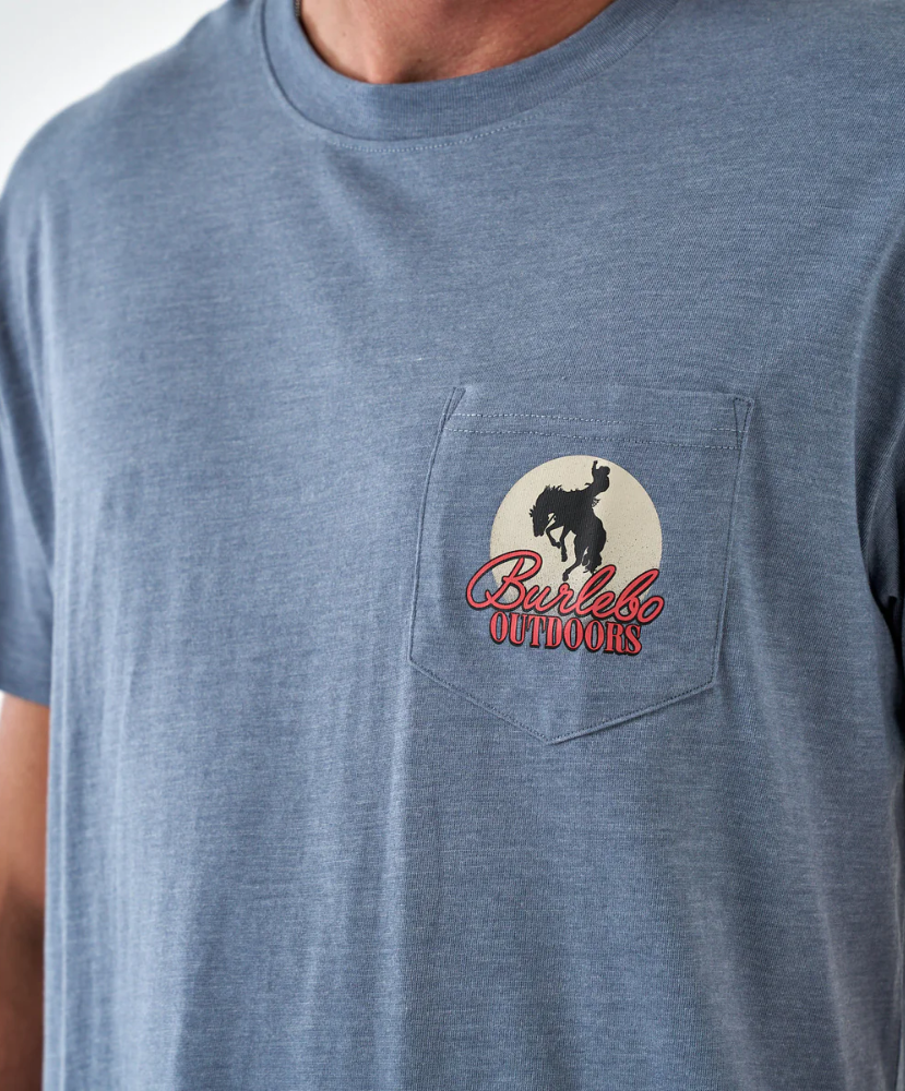 Blue t-shirt with a pocket featuring a logo and text on a plain background Burlebo Outdoors