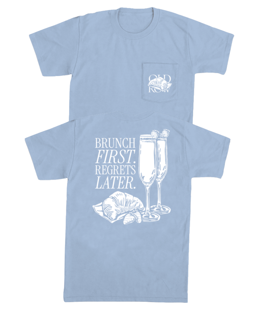 Light blue t-shirt with white graphic design of champagne and brunch and text on a white background