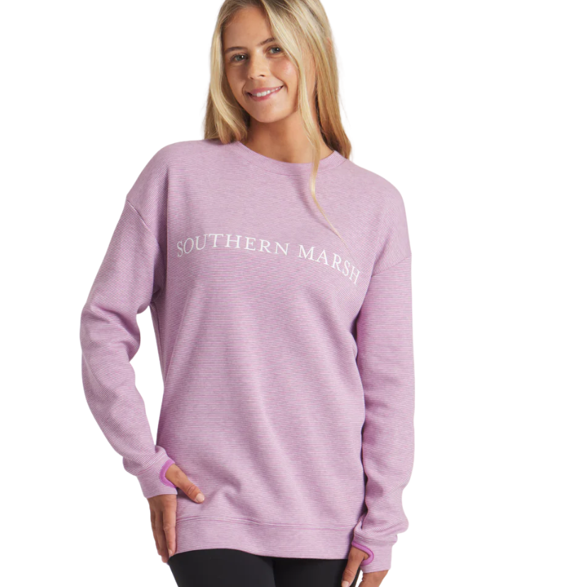 Woman wearing a purple sweatshirt with 'Southern Marsh' logo on a white background
