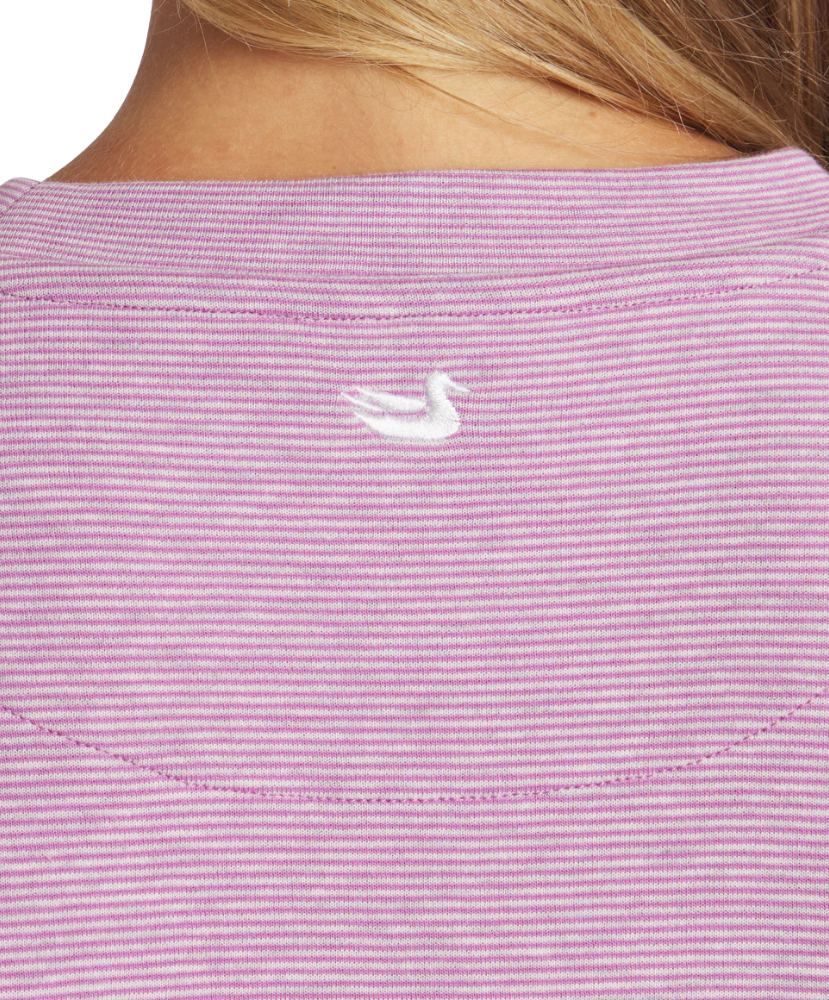 Close-up of a purple striped shirt with a small white logo on the chest.