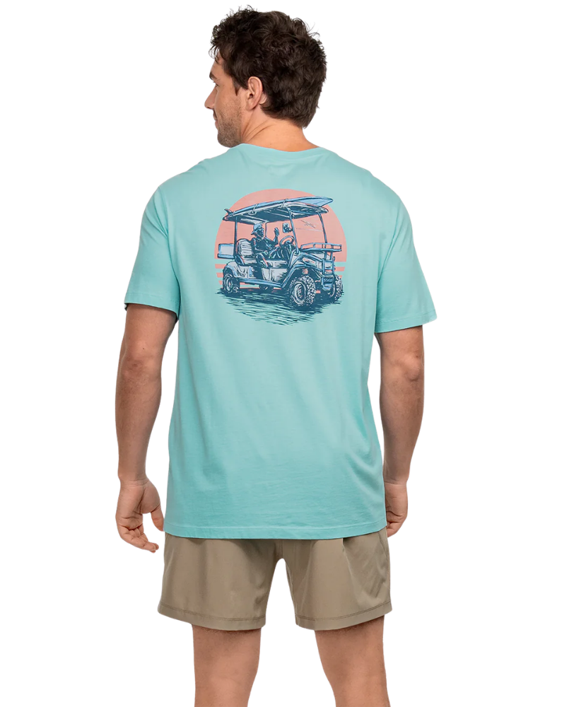 Man wearing a light blue t-shirt with a graphic design on the back, standing against a white background.