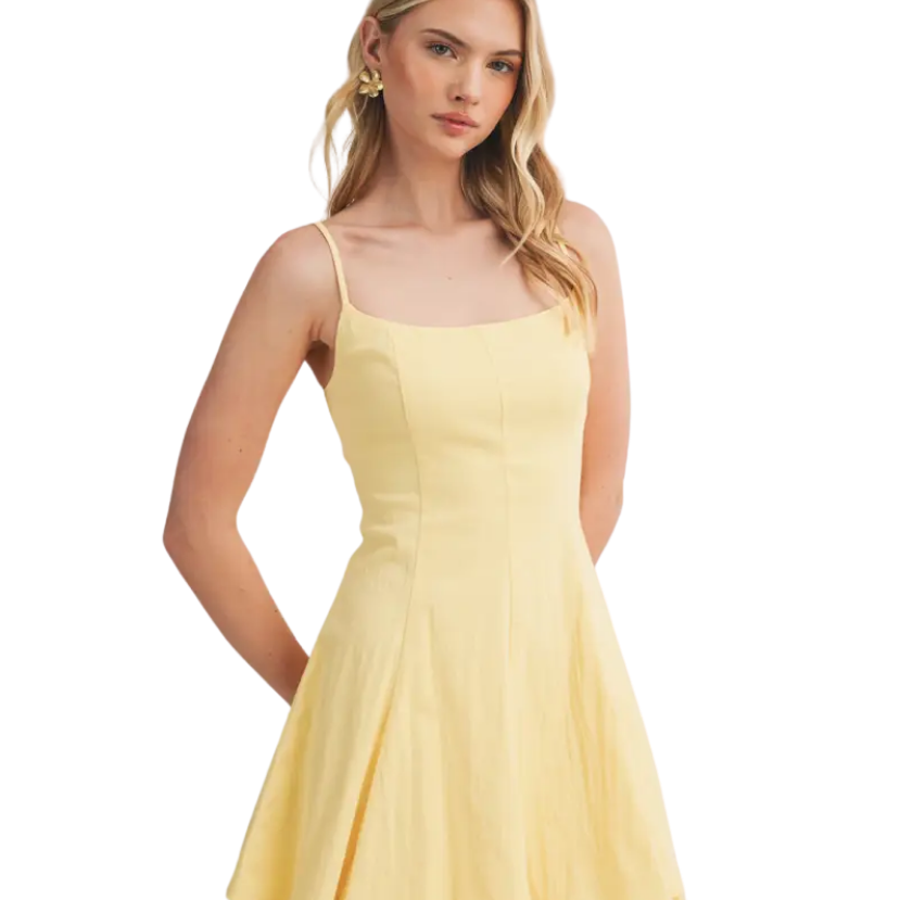 Woman wearing a yellow dress on a white background