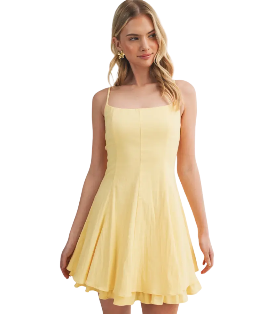 Woman wearing a yellow dress on a white background