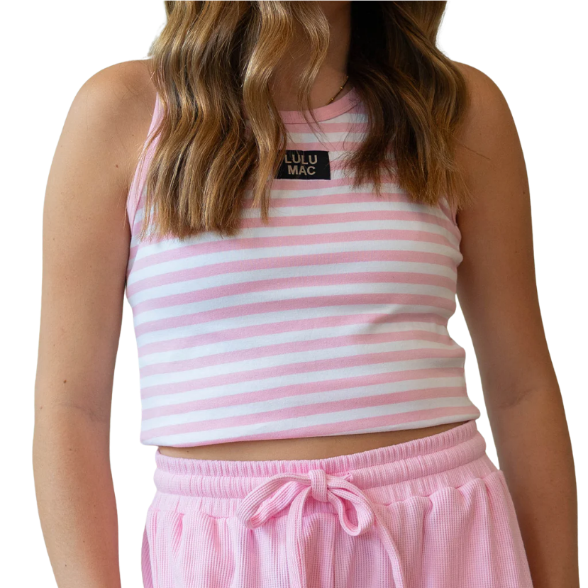 Person wearing a pink and white striped LULU MAC tank top with a visible brand logo on a white background