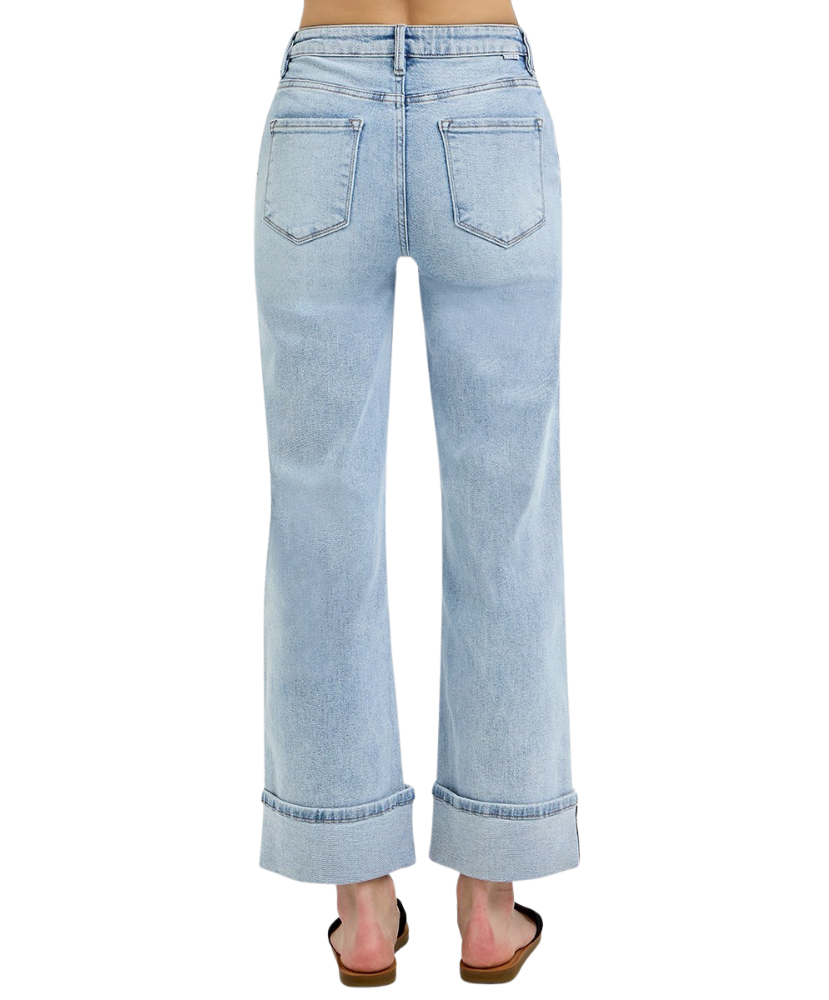 Light blue jeans worn by a person on a white background