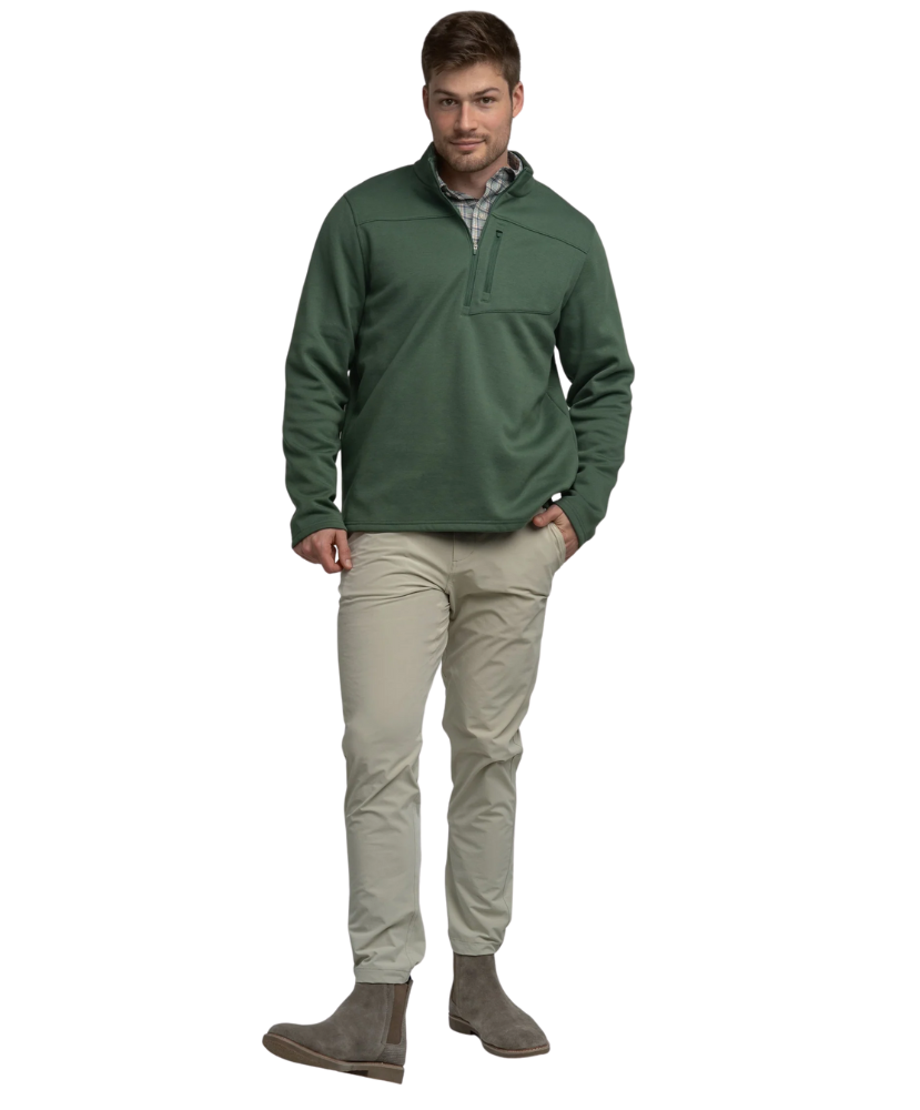Green quarter zip pullover with a plaid shirt underneath on a white background