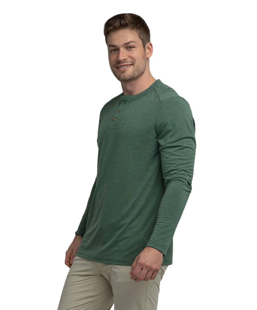 Man wearing a green long-sleeve henley shirt on a white background