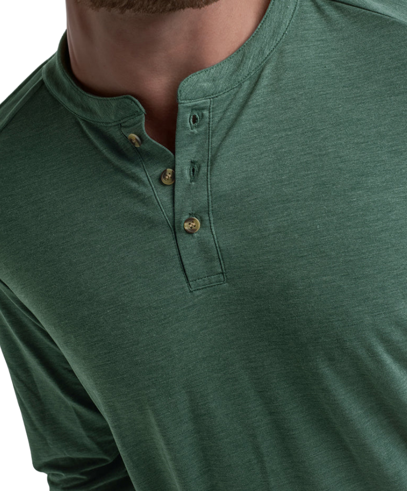 Close-up of a green long-sleeve henley shirt with buttons.
