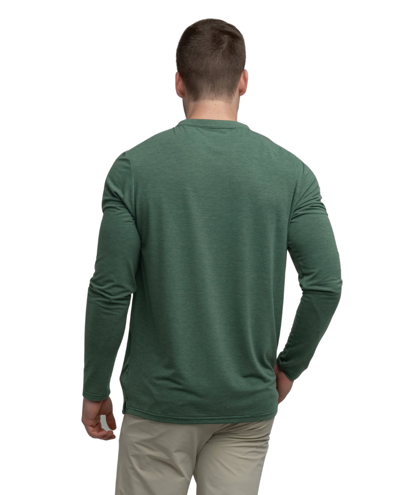 Man wearing a green long-sleeve henley shirt on a white background