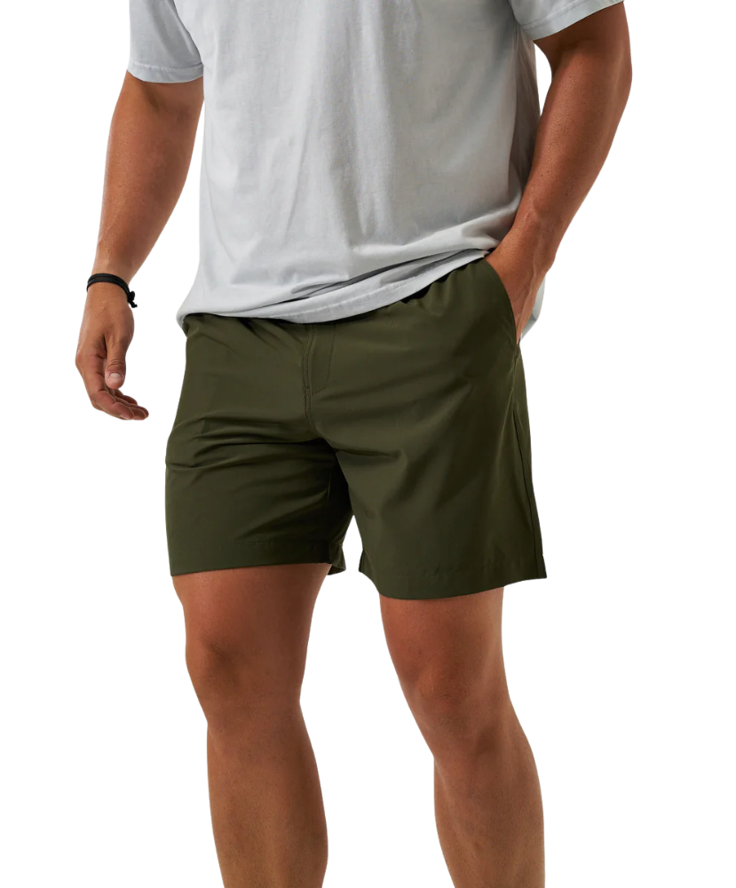 Person wearing green ATHLETIC shorts and a white shirt on a white background