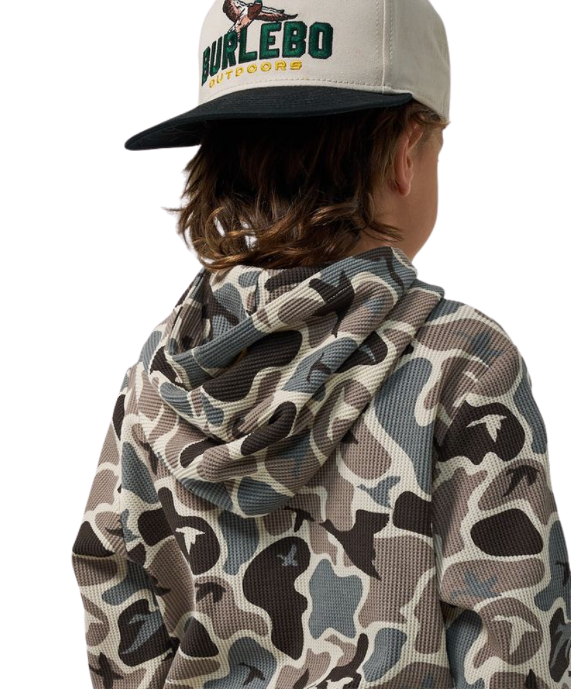 A child shown from the back wearing a beige and gray camouflage hoodie and a beige baseball cap with a black brim. The cap features the brand name 'BURLEBO OUTDOOR' in green and yellow.