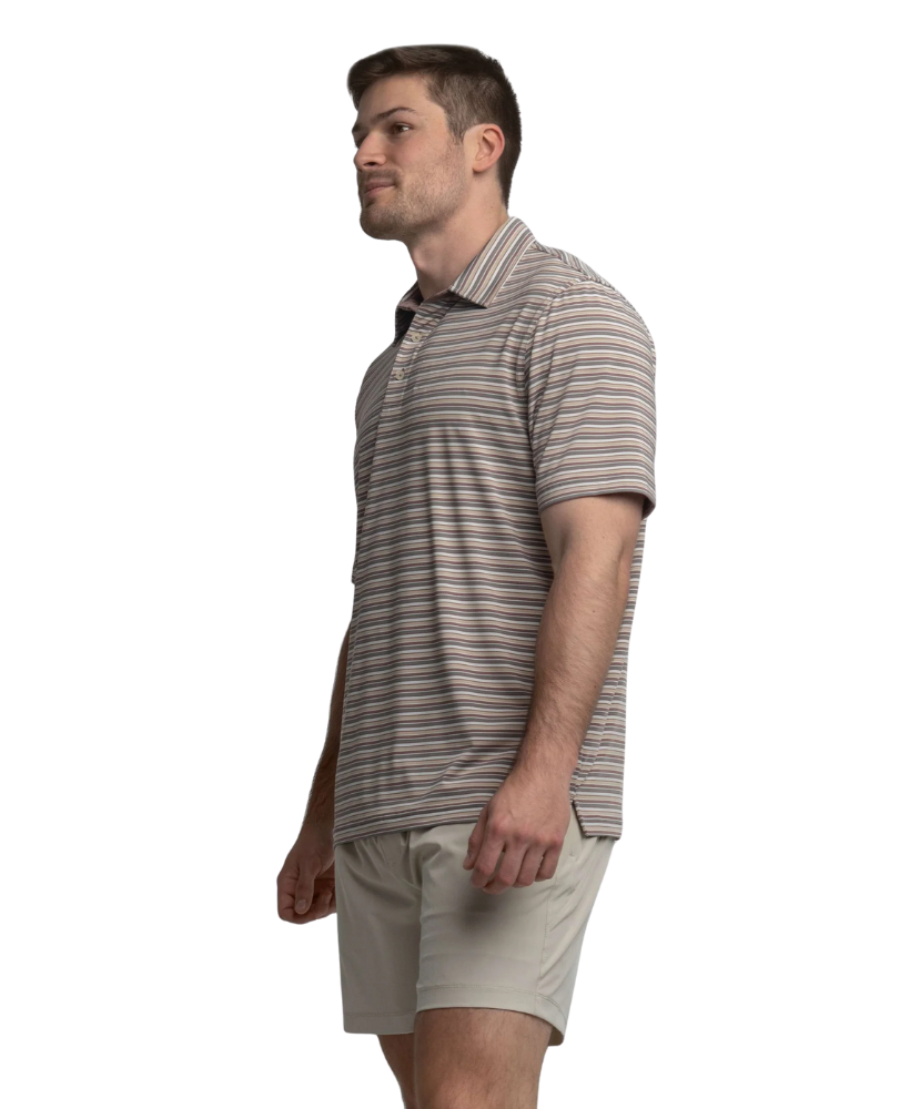 Man wearing a striped polo shirt and beige shorts on a white background