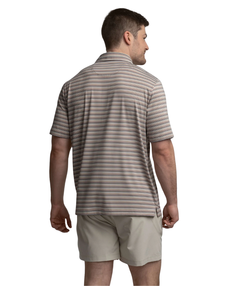 Man wearing a striped polo shirt and beige shorts on a white background