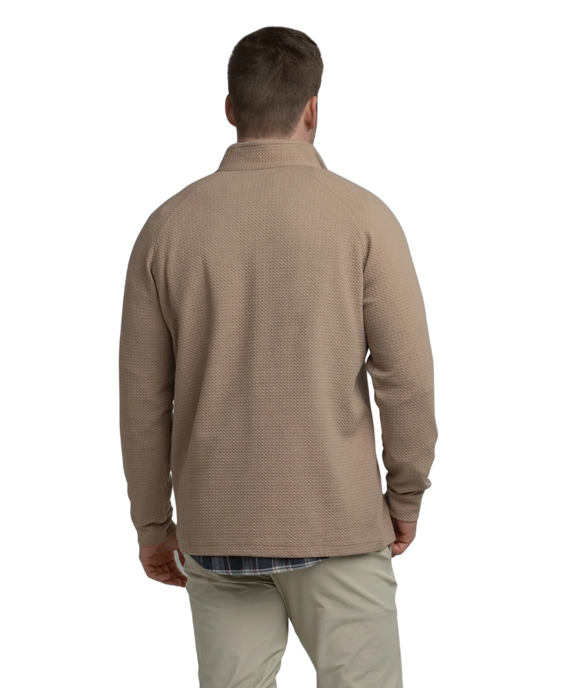 Man wearing a light brown long-sleeve quarter-zip pullover on a white background