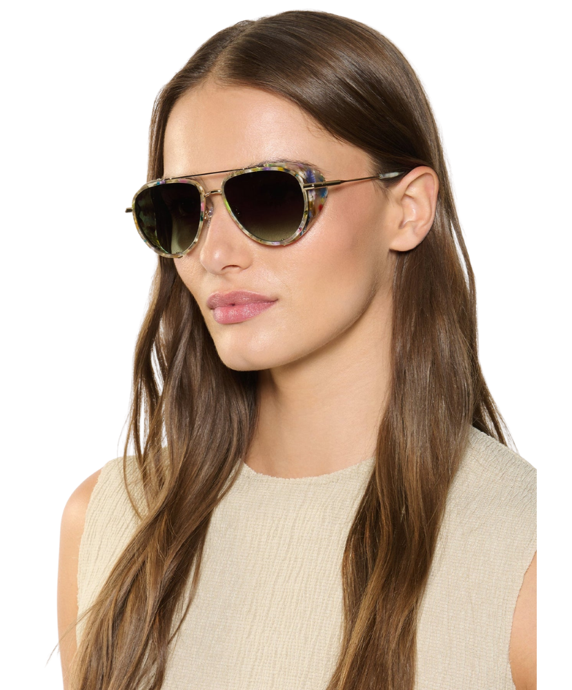 Woman wearing Krewe sunglasses with a neutral background