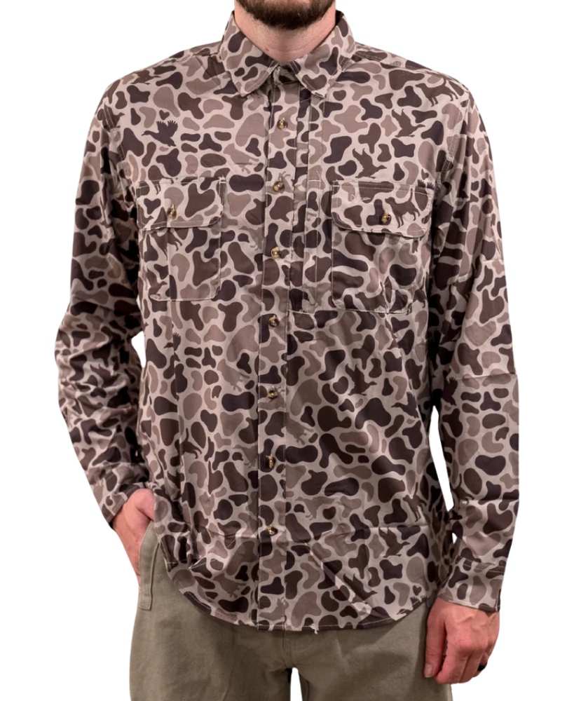 Camouflage patterned shirt worn by a person on a white background