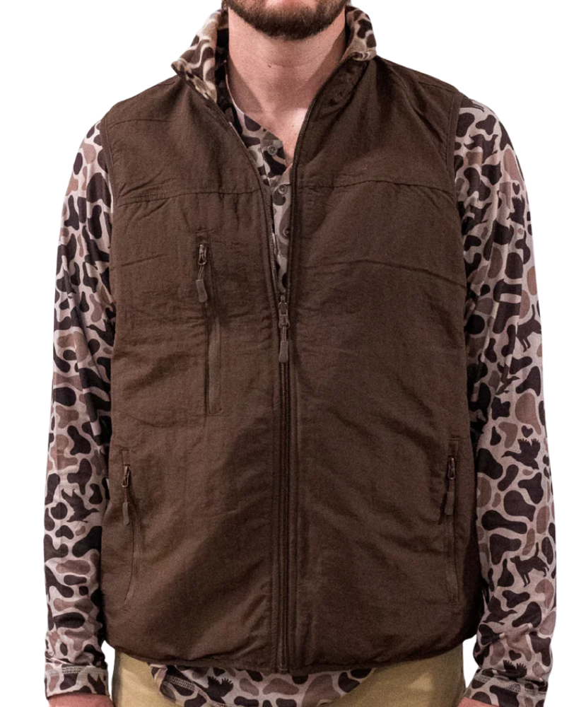 Brown vest with leopard print sleeves worn by a person on a white background