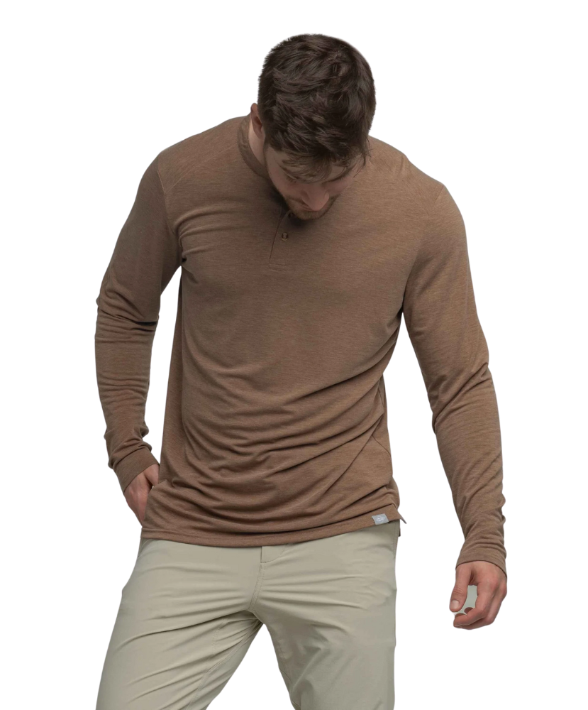 Man wearing a brown long-sleeve HENLEY shirt and beige pants on a white background