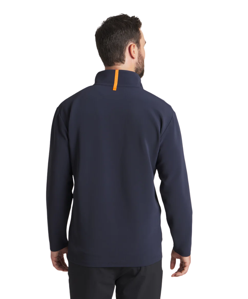 Man wearing a navy blue pullover quarter zip jacket with an orange zipper on a white background