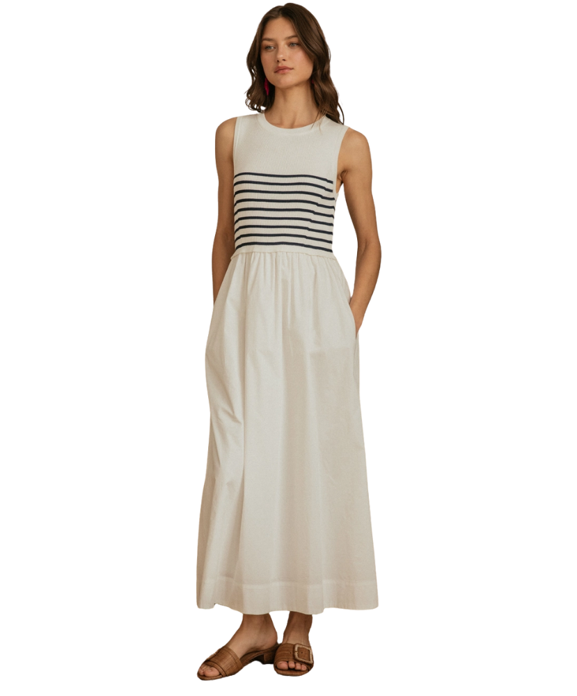 Woman wearing a sleeveless dress with a striped bodice on a white background