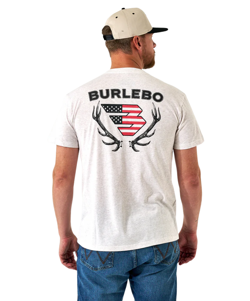 Man wearing a white t-shirt with 'Burlebo' logo on the back and elk horns, standing against a white background