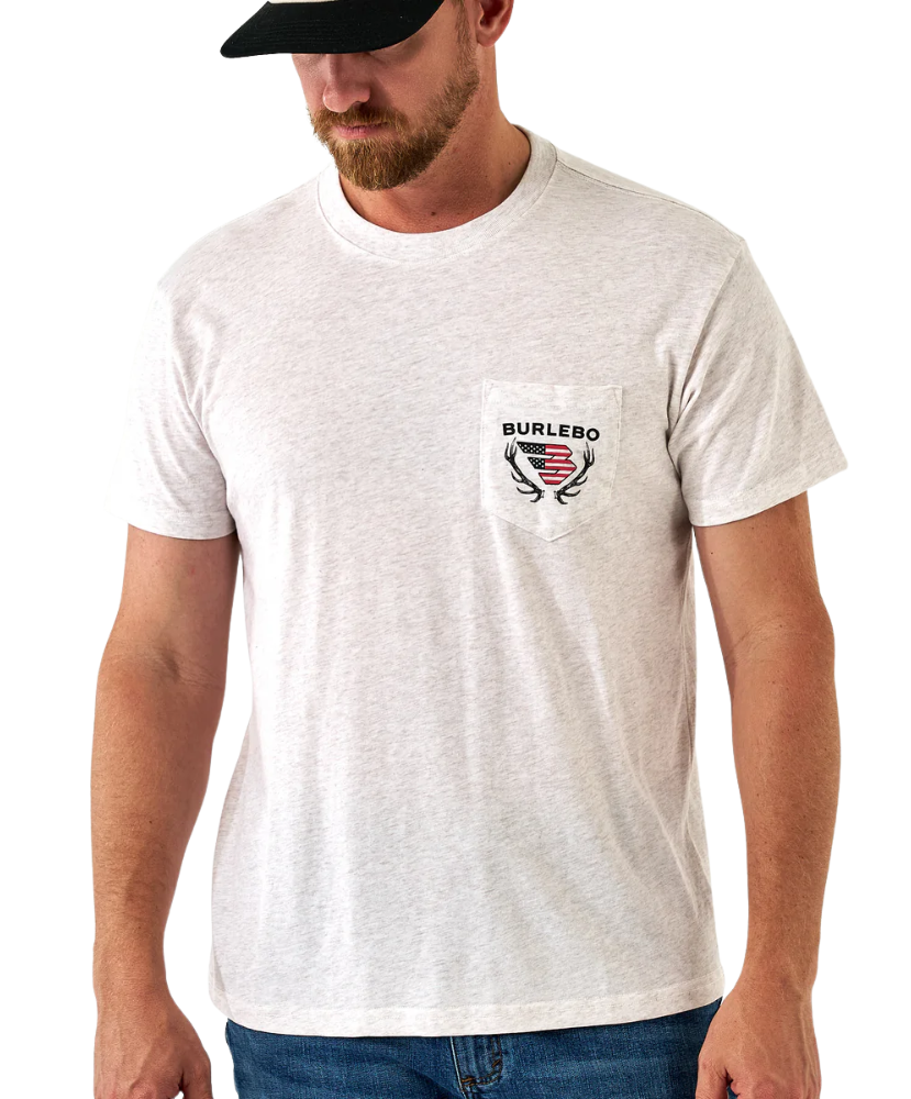 Man wearing a white t-shirt with a logo and text, standing against a white background
