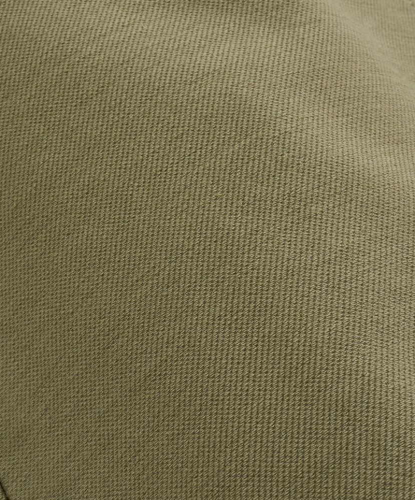 Close-up of a textured green fabric surface