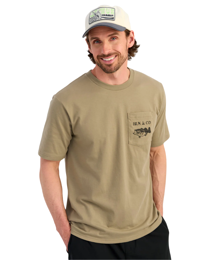Man wearing a khaki t-shirt with a logo on a white background