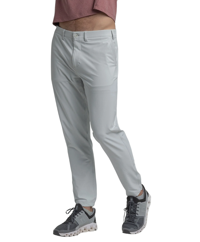 Light gray performance jogger pants worn by a person on a white background