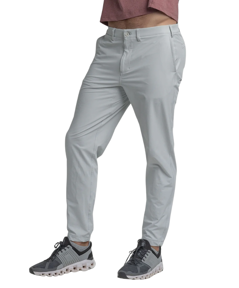 Light gray performance jogger pants worn by a person on a white background
