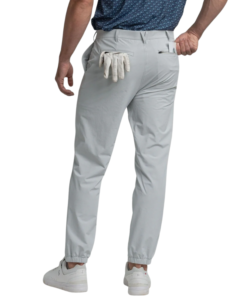 Light gray performance jogger pants worn by a person on a white background