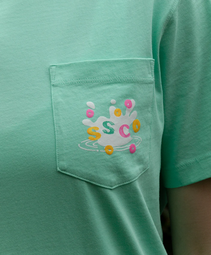 Green shirt with a colorful 'SSCO' logo on the pocket