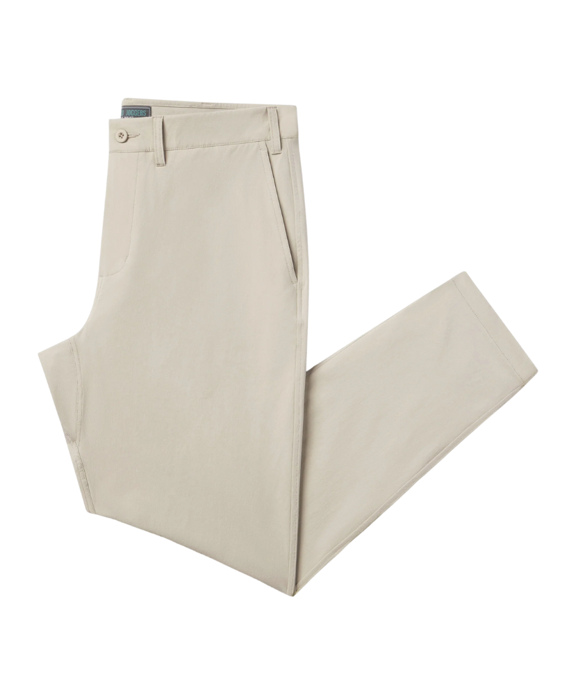 Beige nomad performance jogger pants folded on a white background