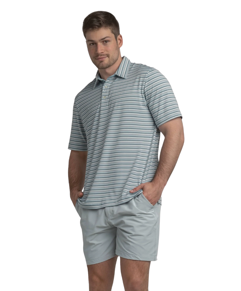 Man wearing a gray, blue, and purple striped polo shirt and shorts on a white background