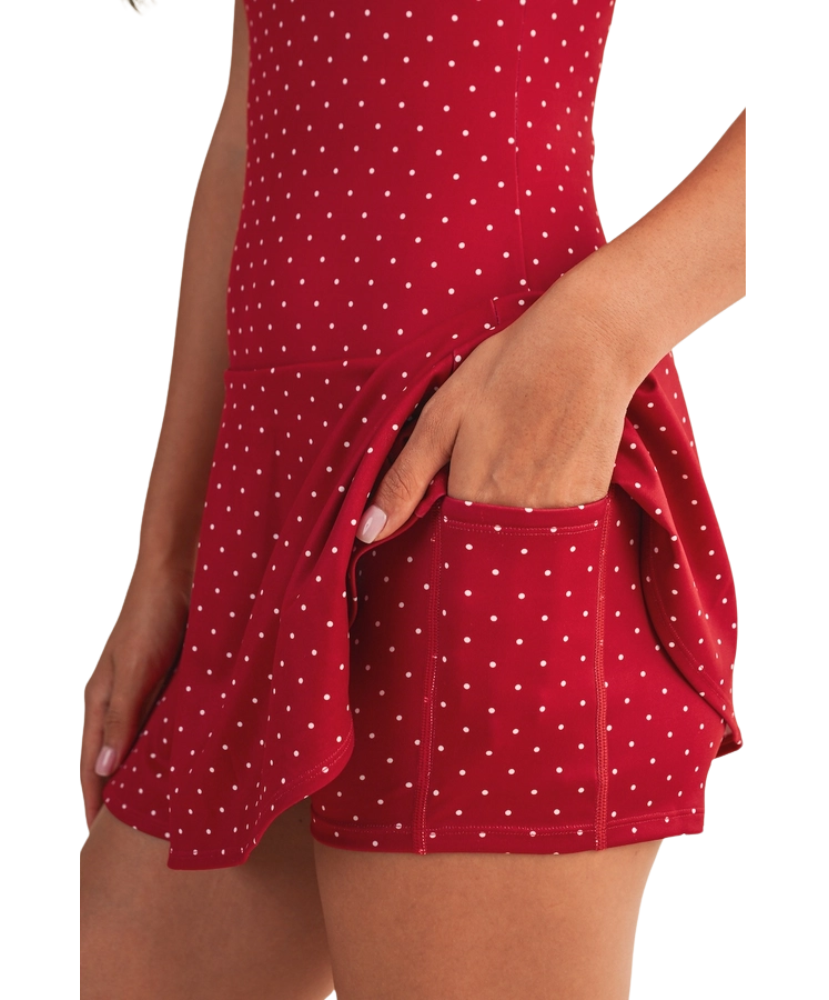 Red polka dot dress with a pocket on a white background