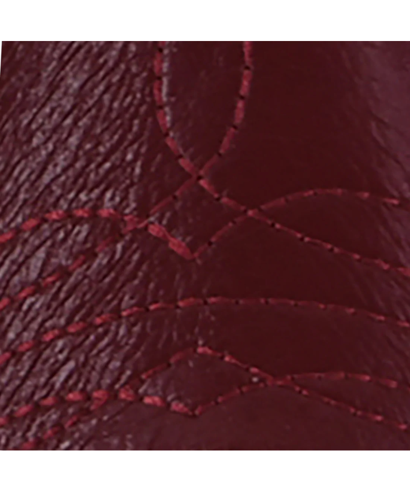 Close-up of a textured red fabric with visible stitching