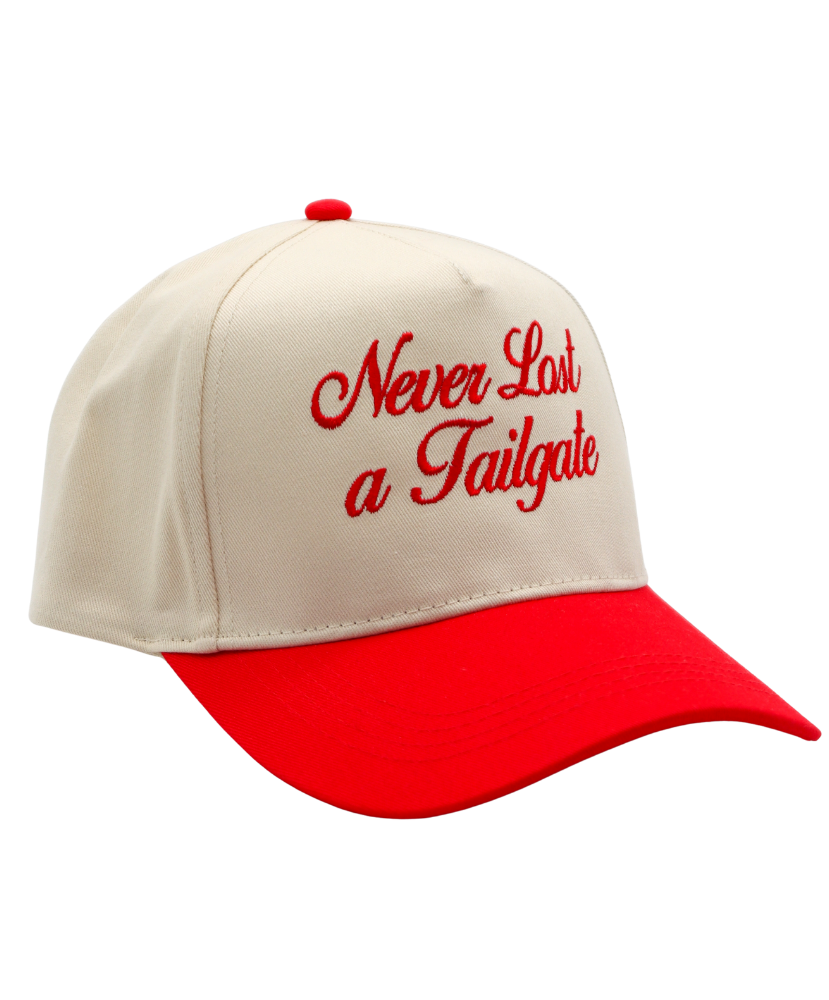 Beige and red cap with 'Never Last a Tailgate' text on a white background