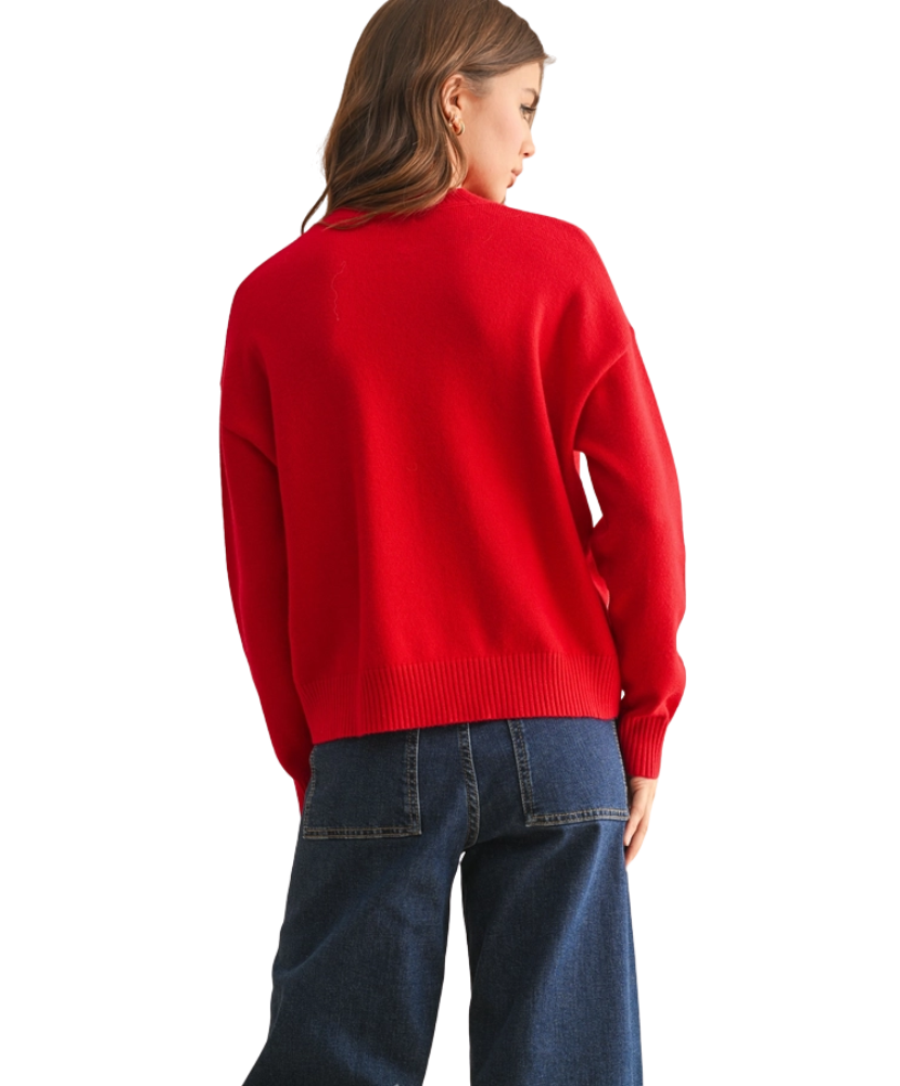 Person wearing a red sweater and blue jeans on a white background