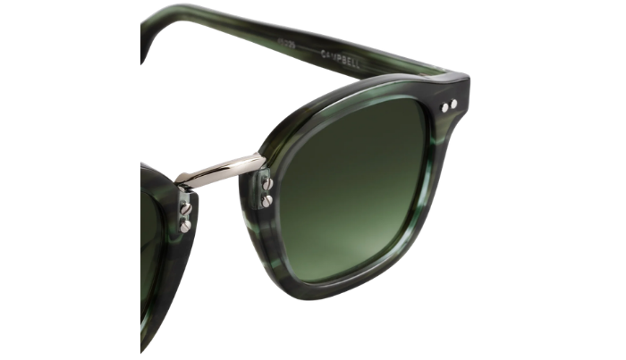 Green Krewe sunglasses with a white background