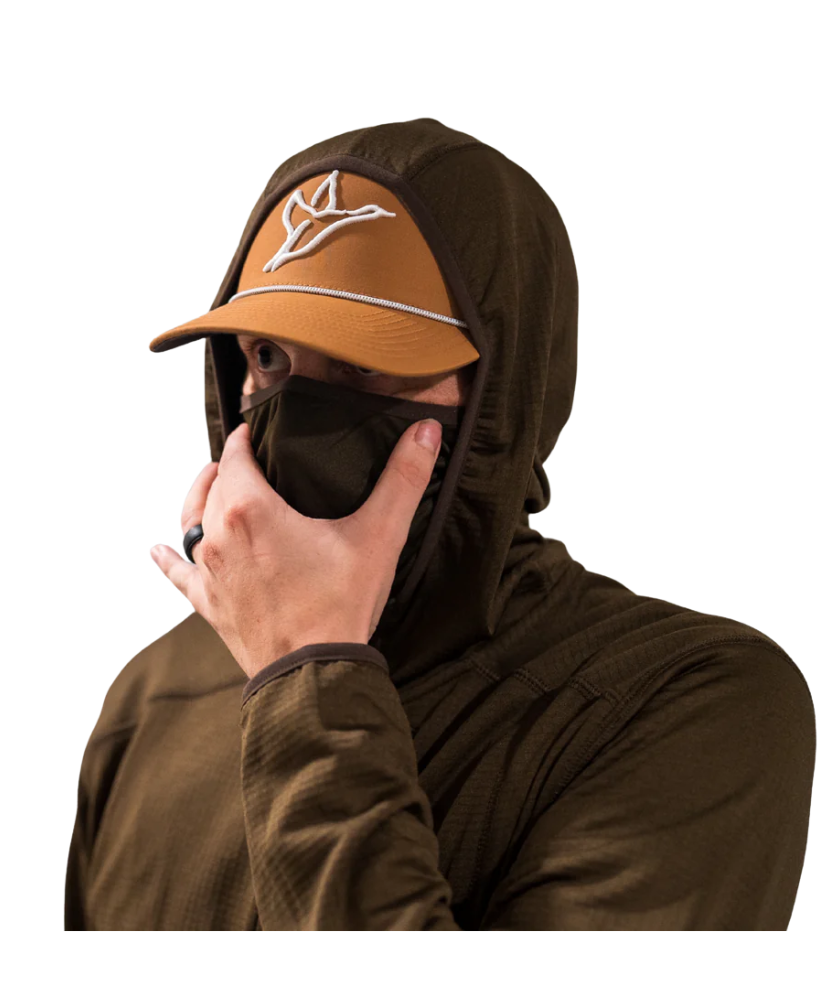 Person wearing a brown cap and matching hoodie with a face mask over a white background