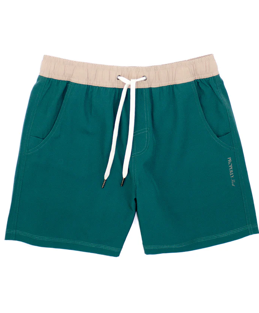 Teal shorts with beige waistband and white drawstring on a white background