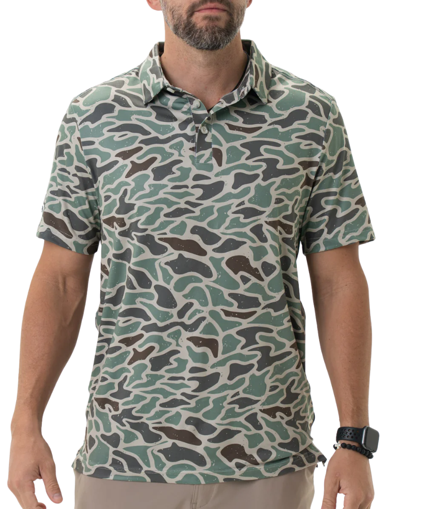 Man wearing a camouflage-patterned polo shirt on a white background