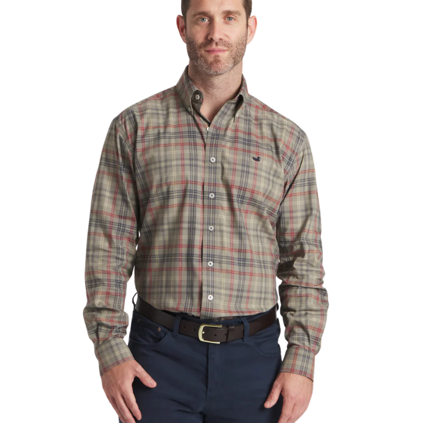 Man wearing a Southern Marsh plaid shirt and navy pants on a white background