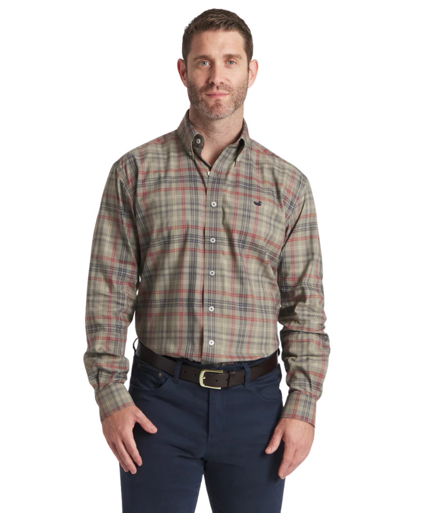 Man wearing a Southern Marsh plaid shirt and navy pants on a white background