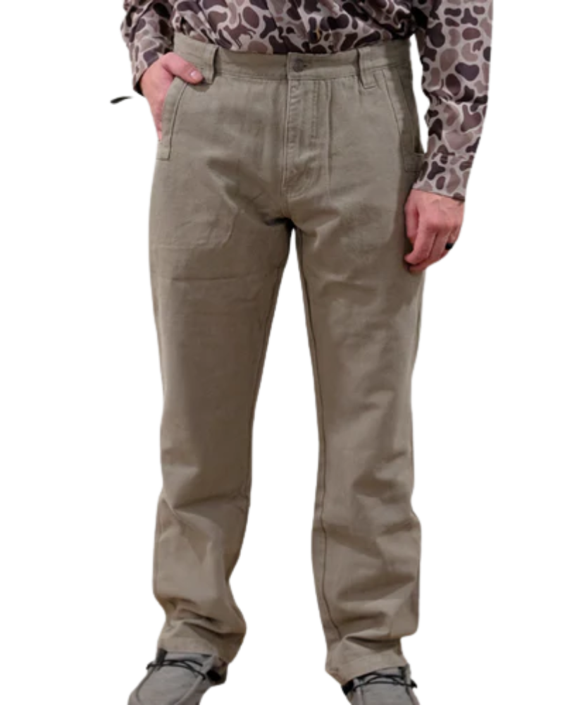 Beige pants worn by a person with a patterned shirt on a white background